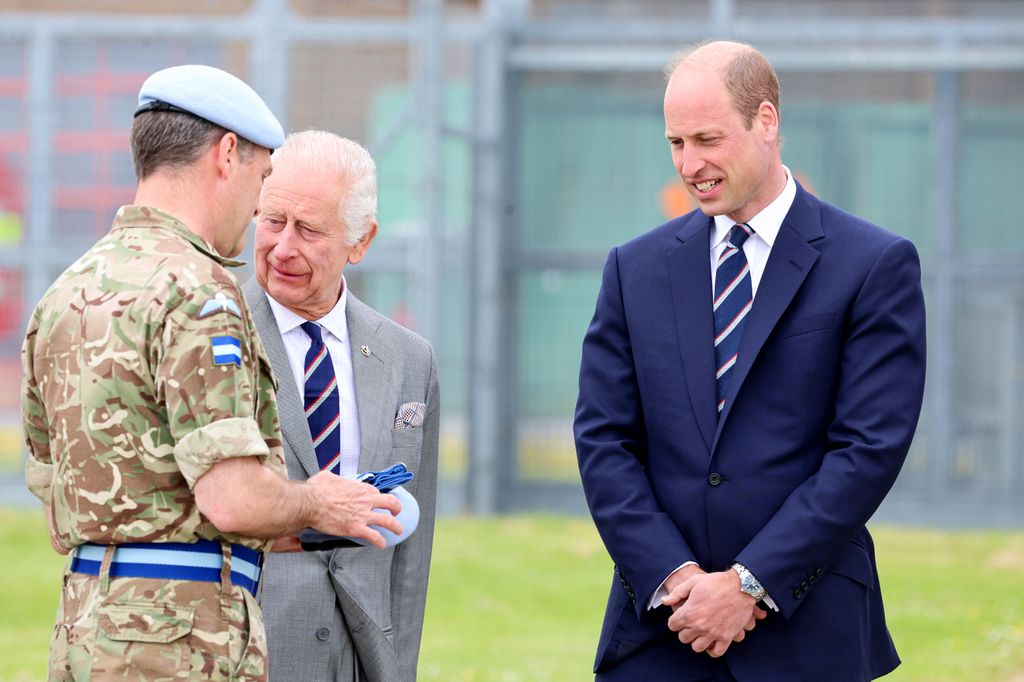 William looks at regiment beret and stable belt