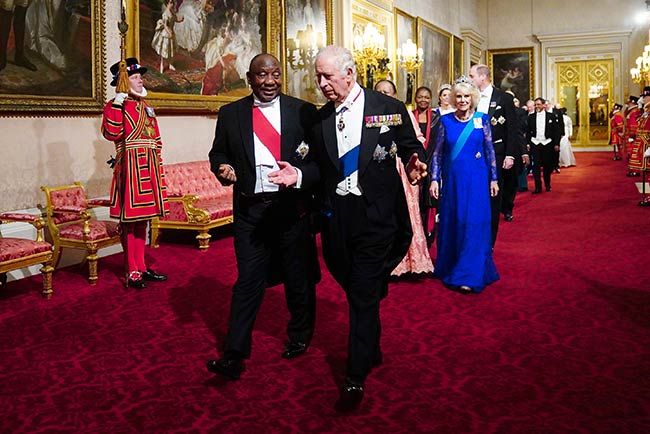 King Charles alongside President Cyril walking into the State Banquet room at Buckingham Palace