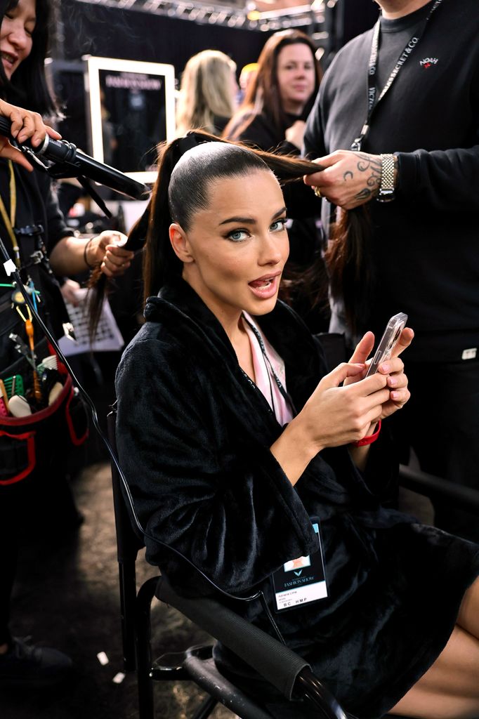 Adriana Lima prepares backstage during the Victoria's Secret Fashion Show 2024