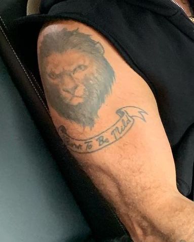 Robbie Williams' lion tattoo