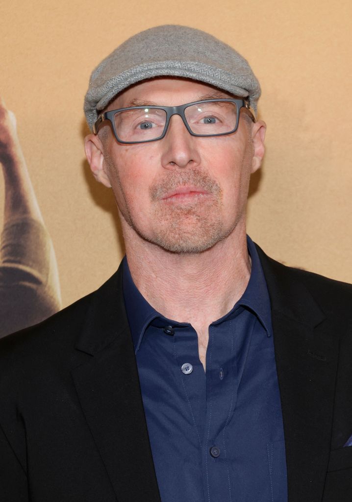 close-up of man in glasses wearing cap