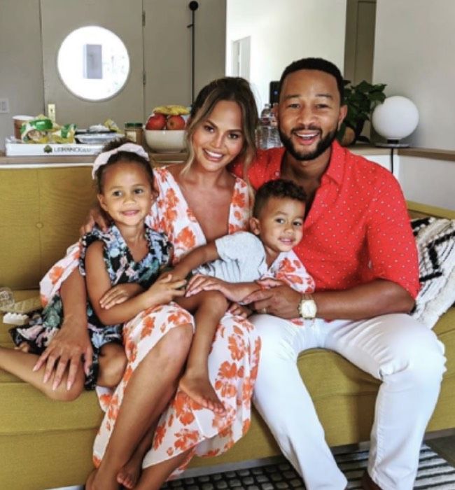 Chrissy Teigen and John Legend pose for a photo with their children Luna and Miles