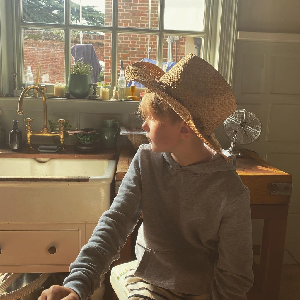 jamie's son in kitchen with old farmhouse sink