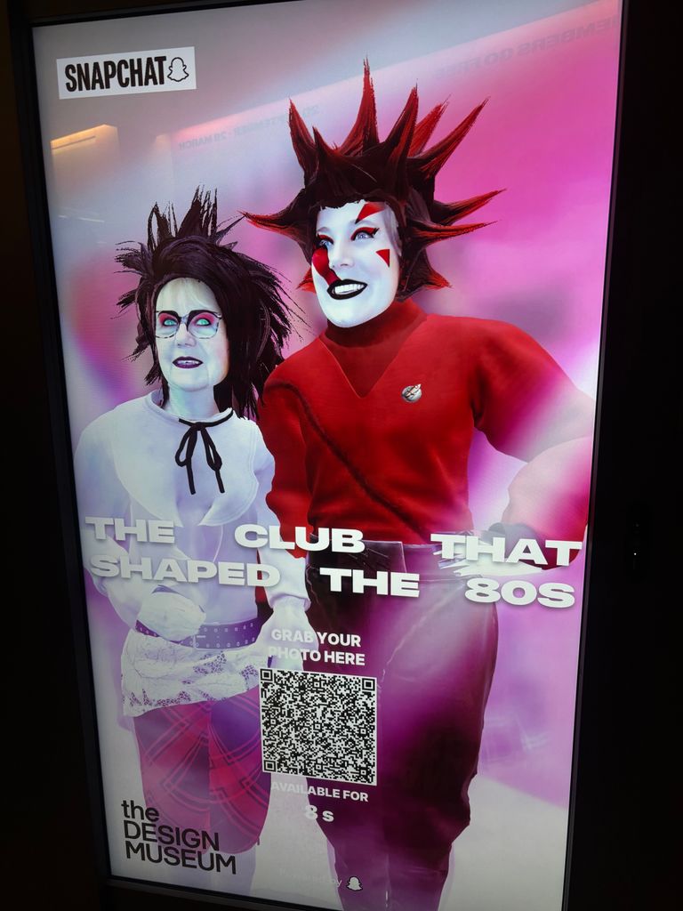 Photo of two women in 1980s hair and makeup