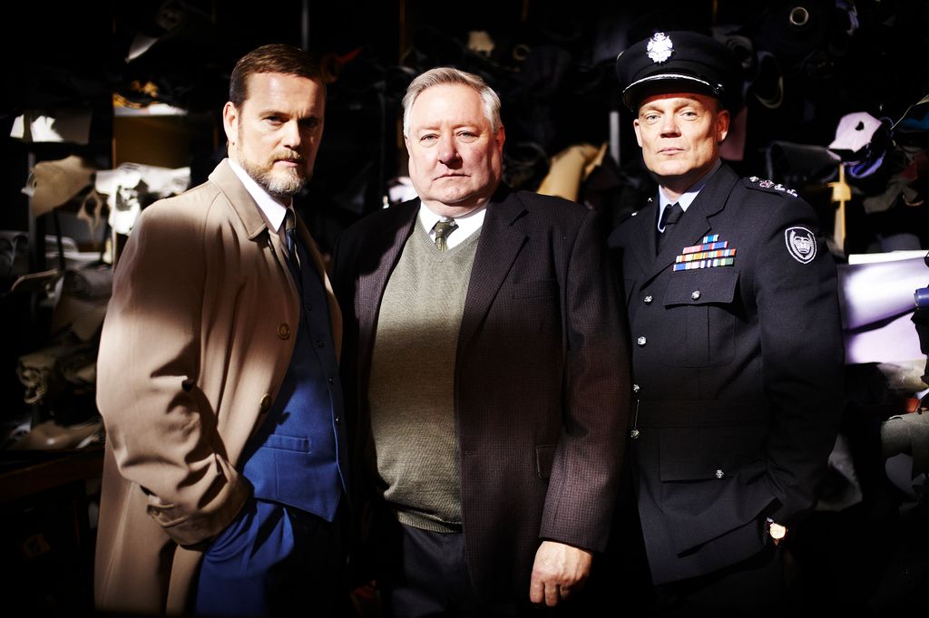 three detectives standing in line