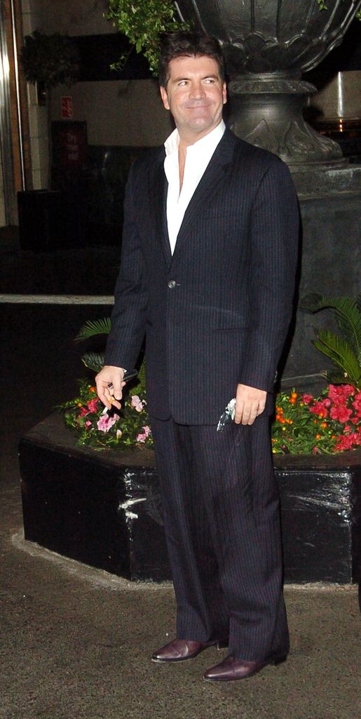 Simon Cowell in black suit at the Savoy Hotel in London