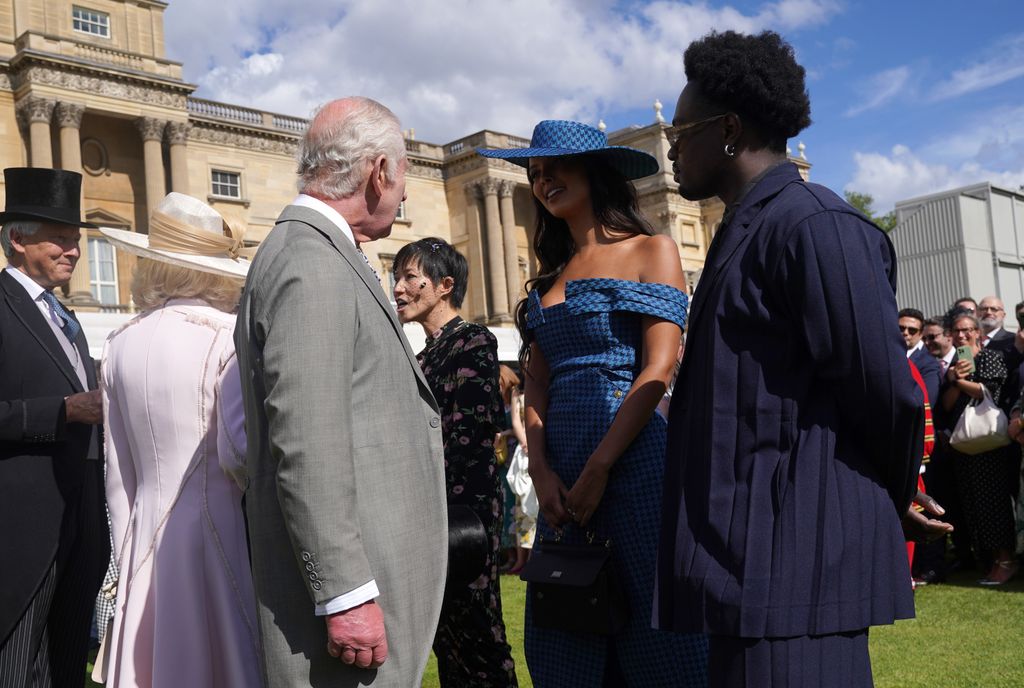 King Charles III speaks with Maya Jama and Campbell Addy at The Sovereign's Creative Industries Garden Party 