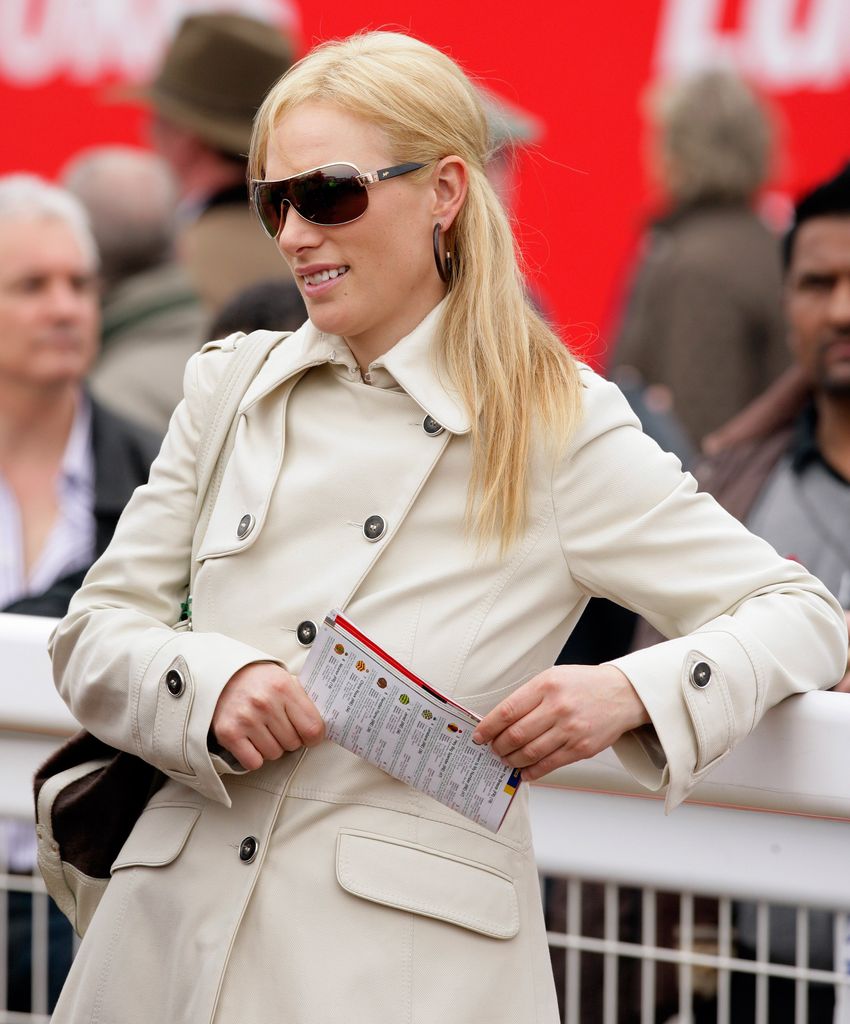 Zara watches the racing as she attends 'Ladies Day' on Day 3 of the Cheltenham Horse Racing Festival in 2010