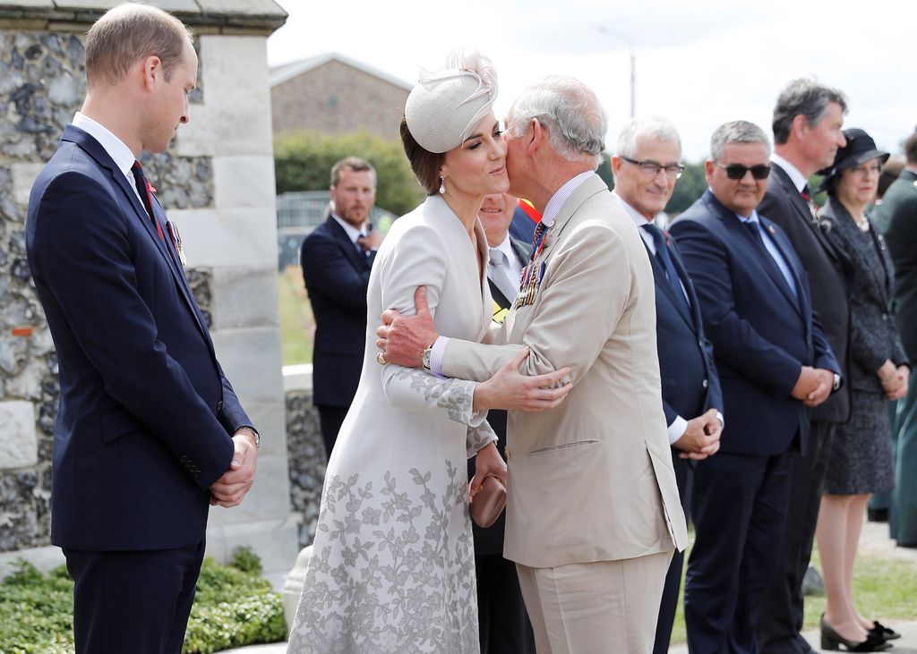 King Charles kisses Princess Kate on the cheek