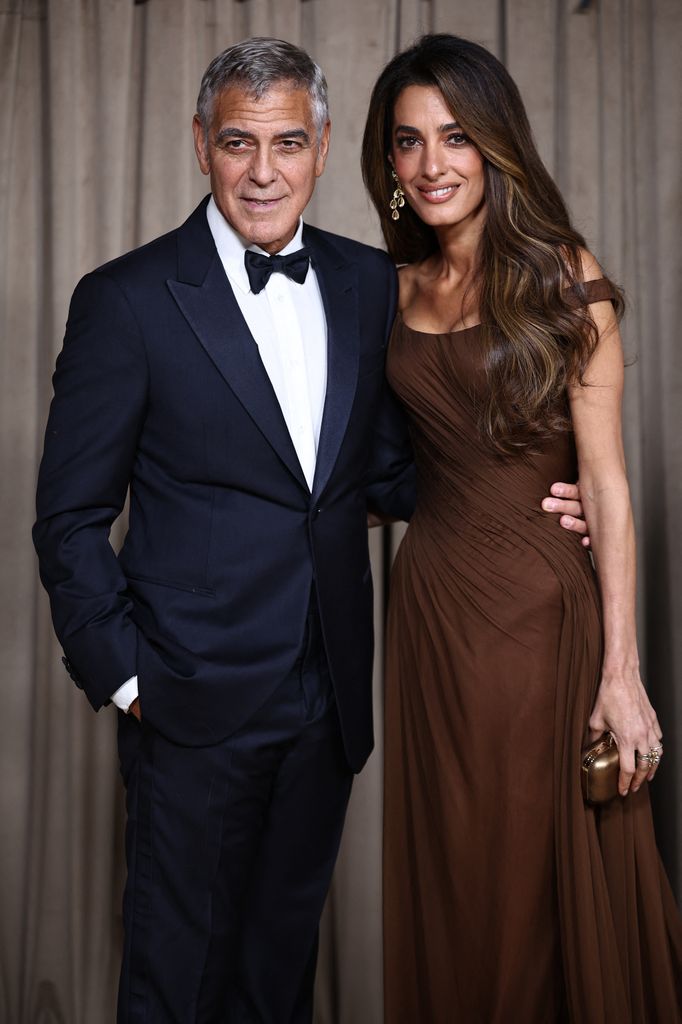 George and Amal Clooney arrive to attend The Albies hosted by the Clooney Foundation at the Natural History Museum