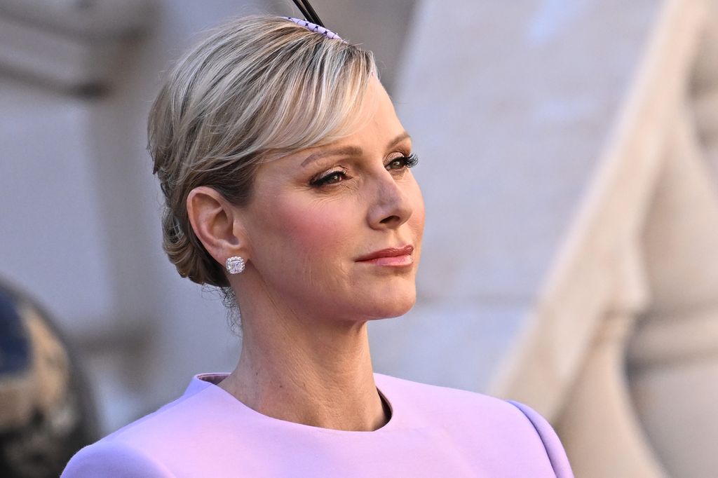 Princess Charlene of Monaco close up in lilac suit