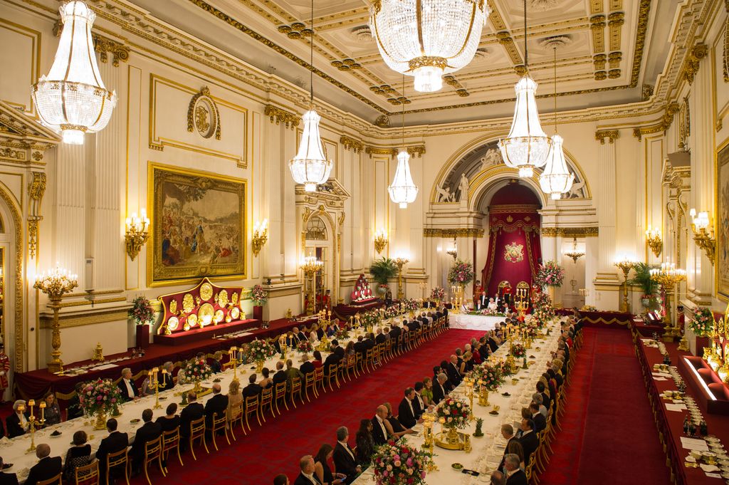 Guests sat inside the Ballroom inside Buckingham Palace