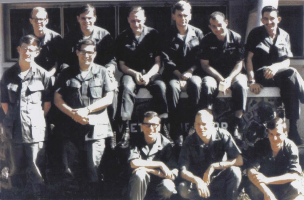 Pat Sajak (3R top row) with fellow troops at American Forces Vietnam Network.