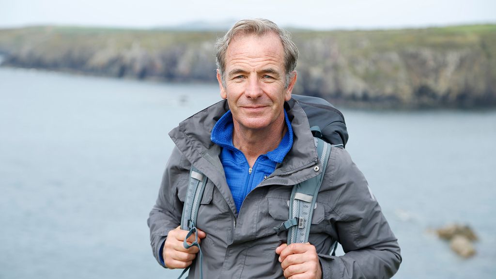 Robson Green standing by the coast. 