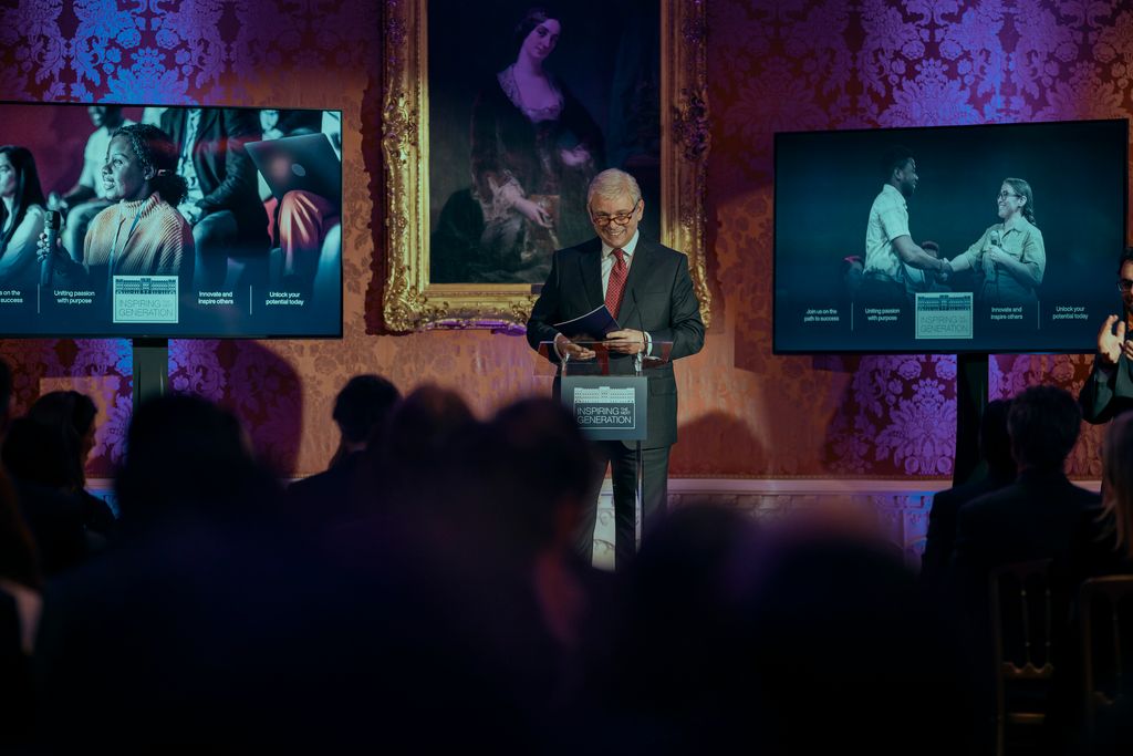 Michael Sheen as Prince Andrew giving a speech