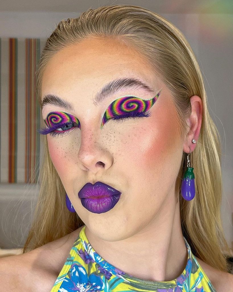 Woman with retro swirl purple makeup 