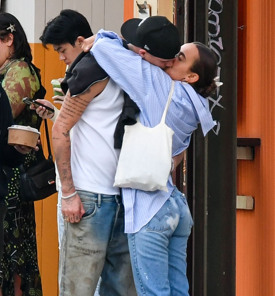 Romeo Beckham and Gray Sorrenti kiss