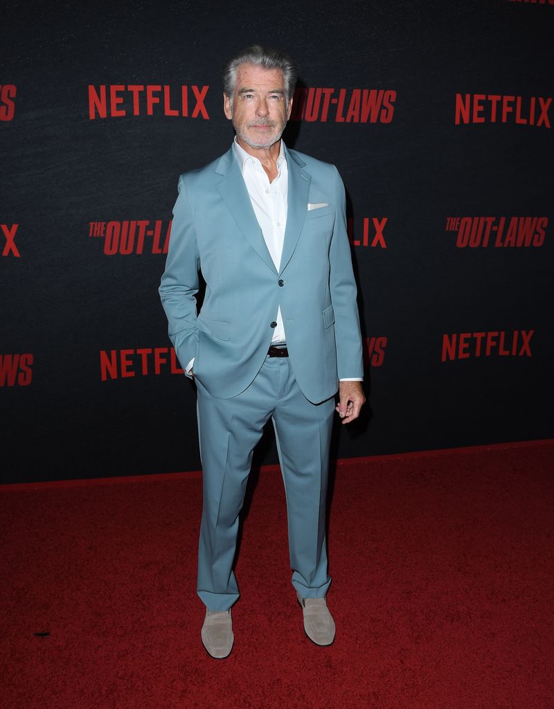 pierce brosnan blue suit on red carpet 