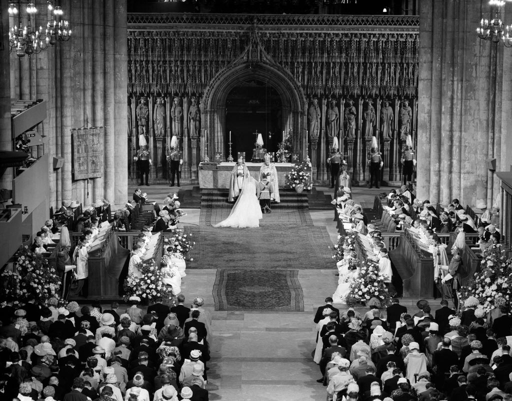 The Duke of Kent and his bride, Katharine Worsley kneeling in front of the altar in York Minster in black and white photo