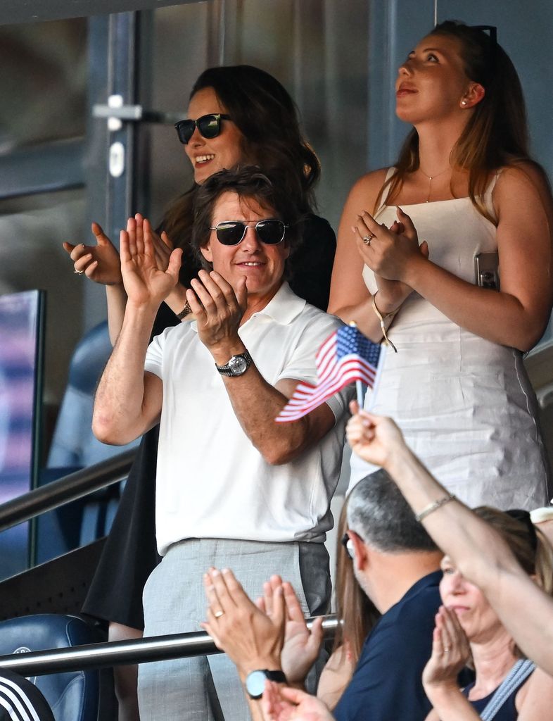 Actor Tom Cruise celebrates a goal by Mallory Swanson of Team United States 