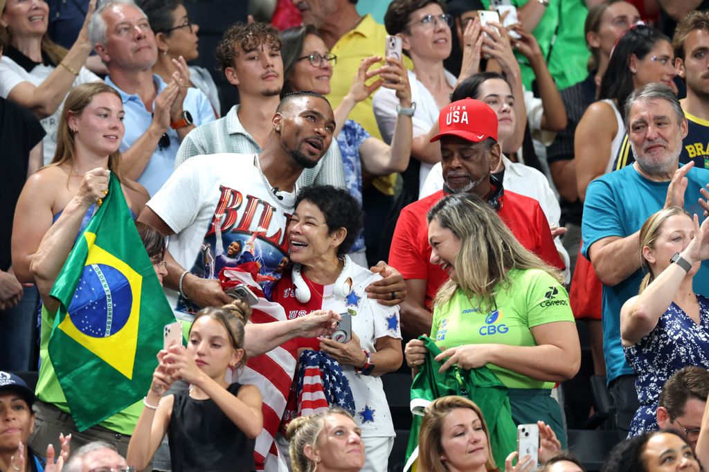 Simone's husband Jonathan Owens and parents Nellie and Ronald Biles celebrate as the Team United States wins the gold medals during the Artistic Gymnastics Women's Team Final