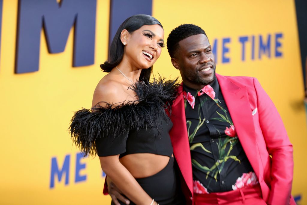  Eniko Parrish and Kevin Hart both smiling with their arms around eachother looking at the camera on the Los Angeles Premiere of Netflix's "Me Time" 
