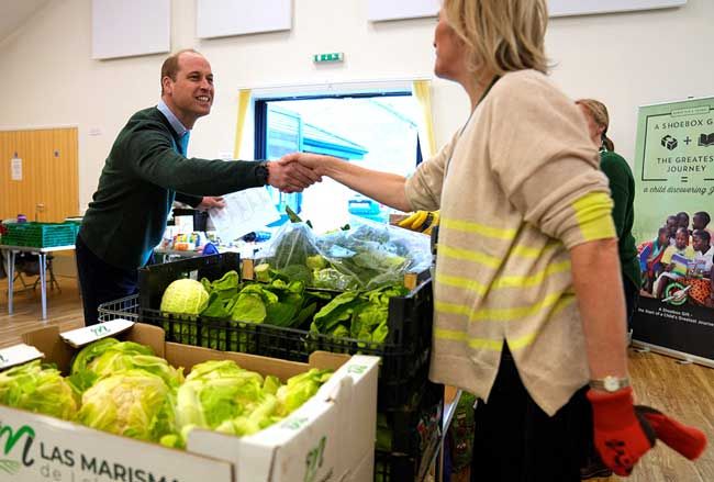 Prince William packs food parcels