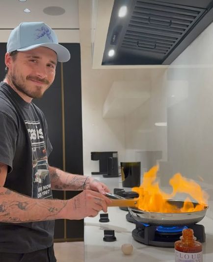 Brooklyn Beckham cooking in a kitchen