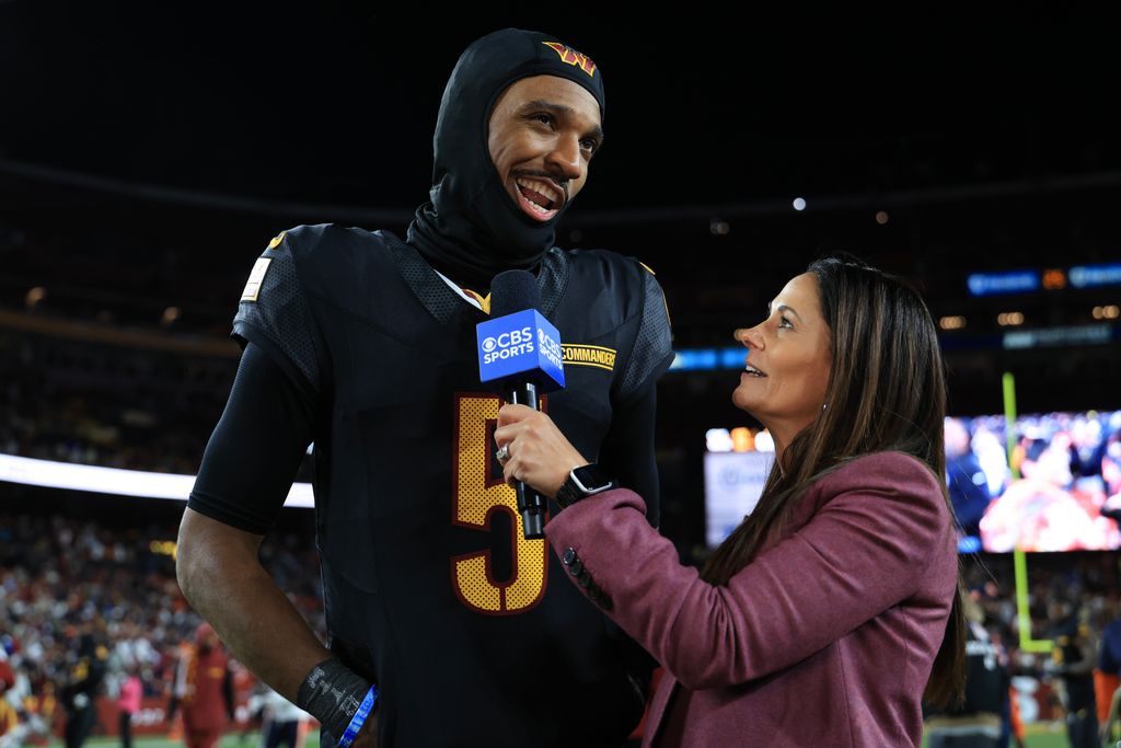 Jayden Daniels #5 of the Washington Commanders is interviewed after his team defeated the Chicago Bears at Northwest Stadium on October 27, 2024 in Landover, Maryland