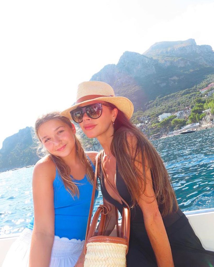 Victoria and Harper Beckham on a boat in the sun 