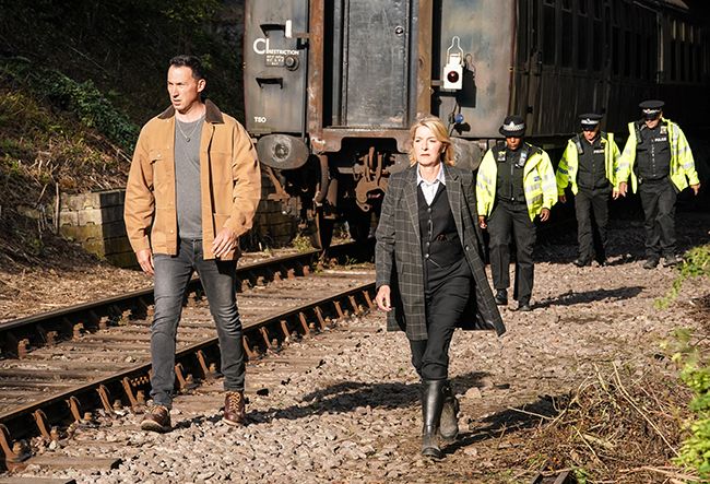 David Caves and Jemma Redgrave walk along train track in Silent Witness episode