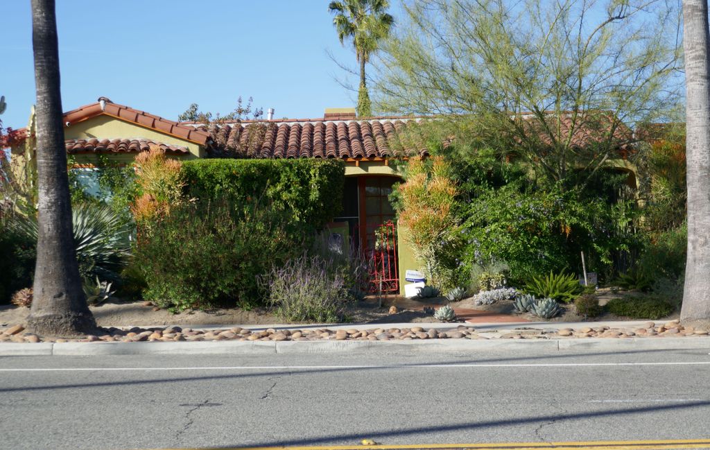 exterior of home with bushy garden