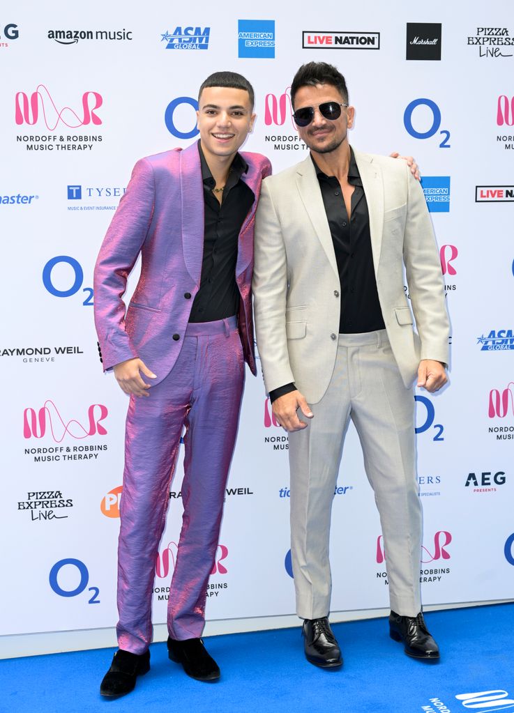 junior and peter andre posing for photo 