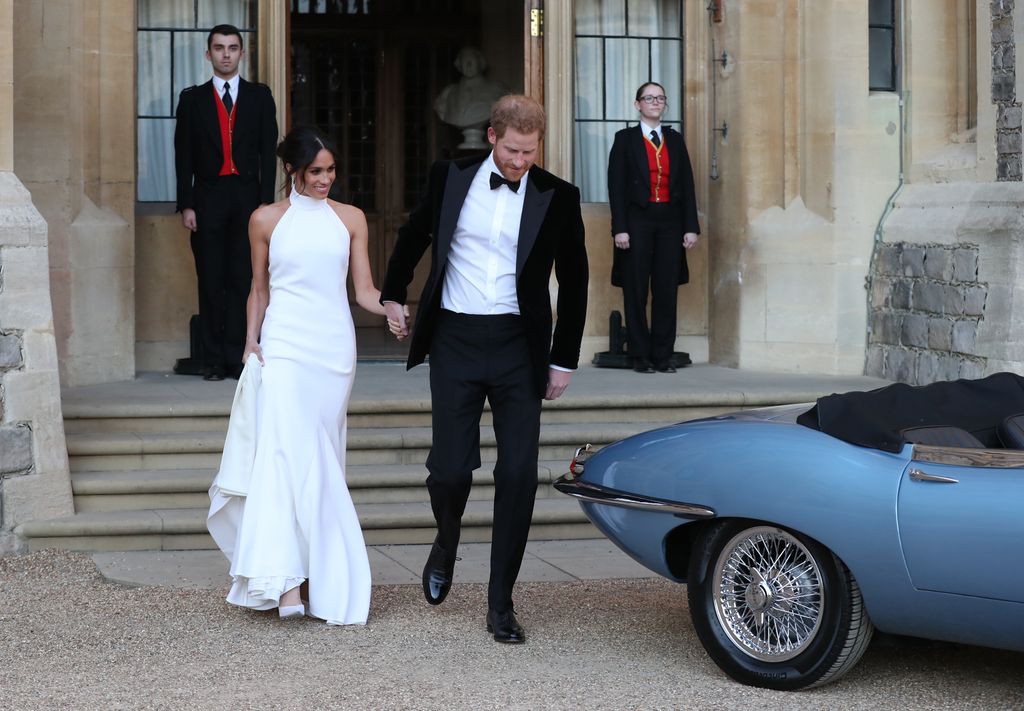 Newlyweds Harry and Meghan about to leave Windsor Castle for an evening reception in a special all-electric Jaguar E-Type