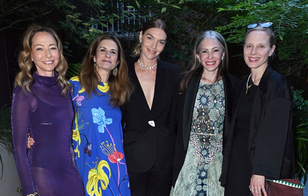 Whitney Hawkings, Livia Firth, Arizona Muse, Carmen Busquets and Lucy Cleland line up in colourful dresses smiling 