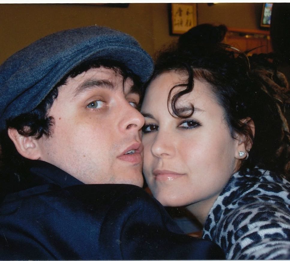 photo of billie joe armstrong and wife adrienne resting their faces against each other