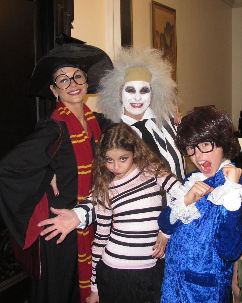 family posing in halloween outfits 