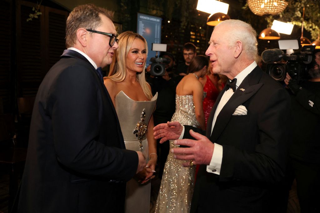 The duo were photographed laughing with King Charles III