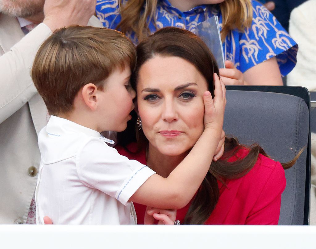 Prince Louis hugging Princess Kate in pink