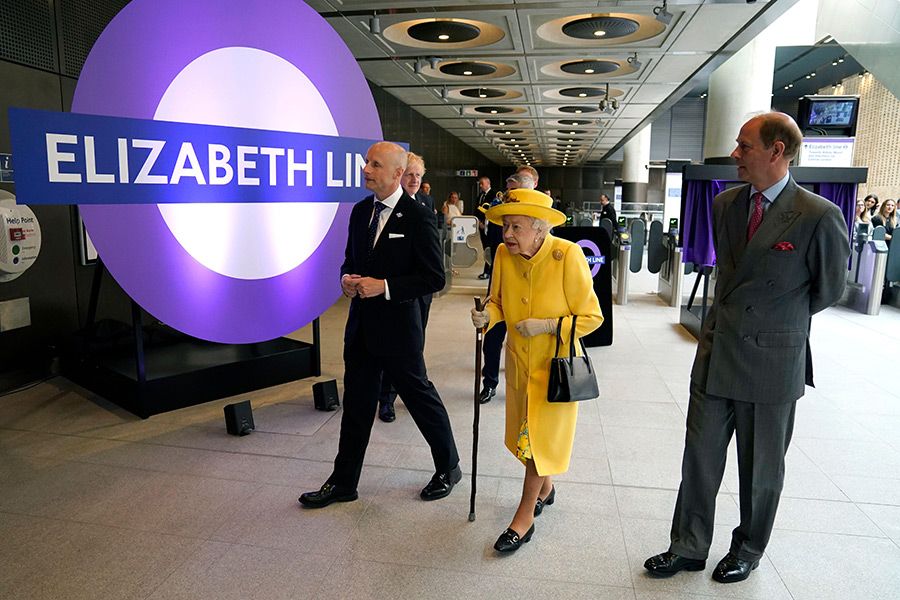 the queen next to elizabeth line sign