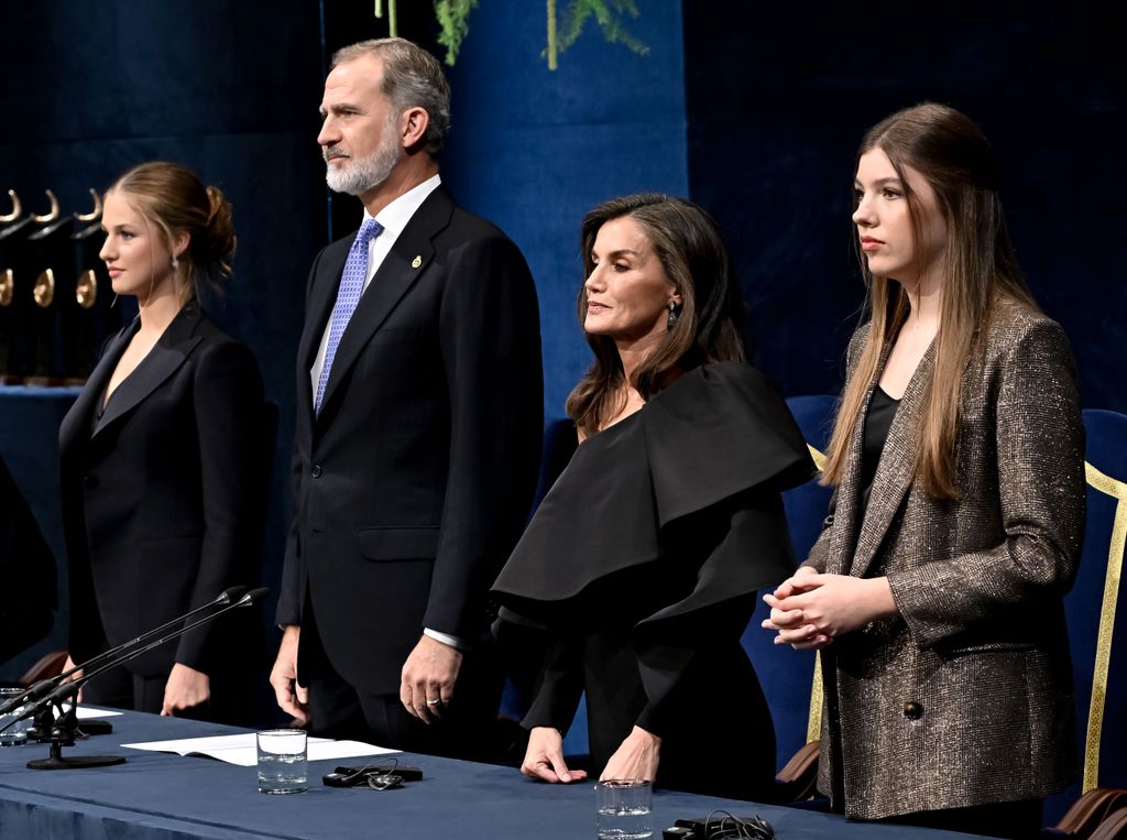 Princess Leonor standing with King Felipe, Queen Letizia and Infanta Sofia