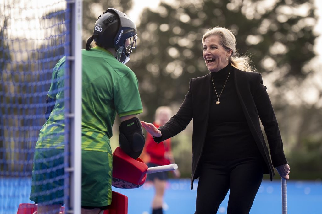 The Duchess of Edinburgh speaks with goalkeeper Miriam Pritchard during a visit to England Hockey
