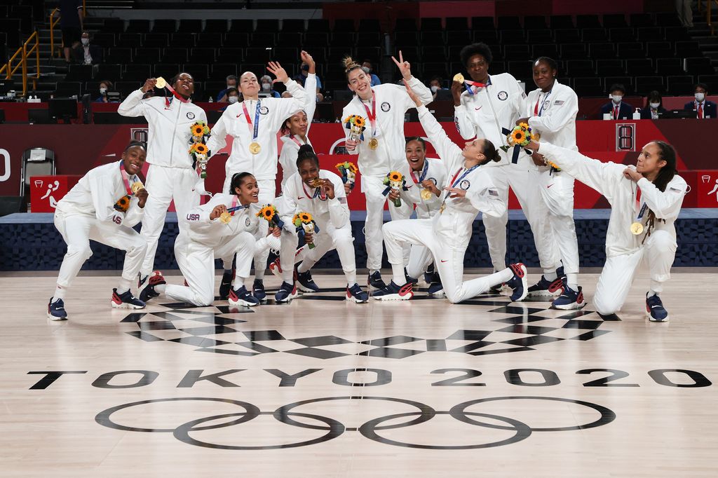 Team United States pose for photographs with their gold medals during the Women's Basketball medal ceremony on day sixteen of the 2020 Tokyo Olympic games at Saitama Super Arena on August 08, 2021 in Saitama, Japan