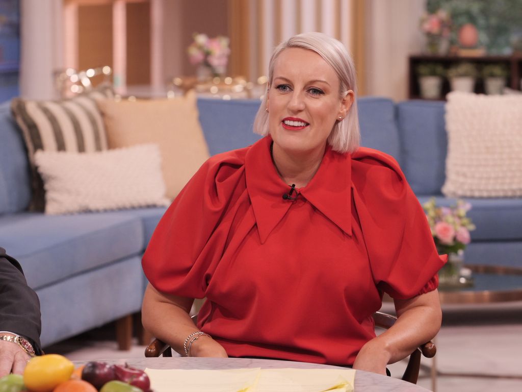 steph mcgovern on this morning in red statement blouse