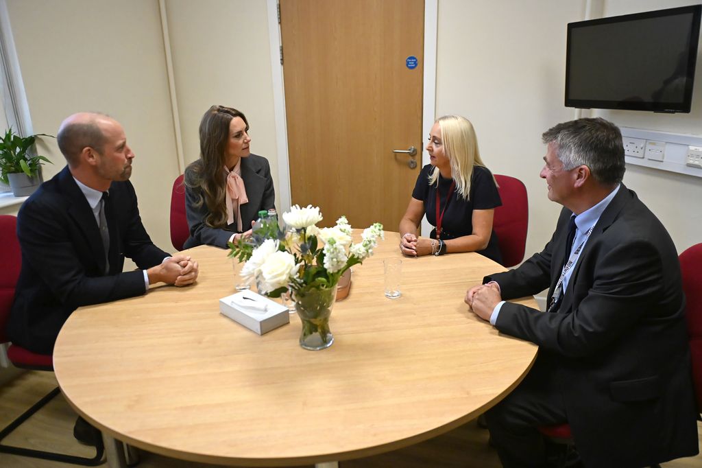 William and Kate speaking to staff during a visit to Farnborough Road Infant and Junior School