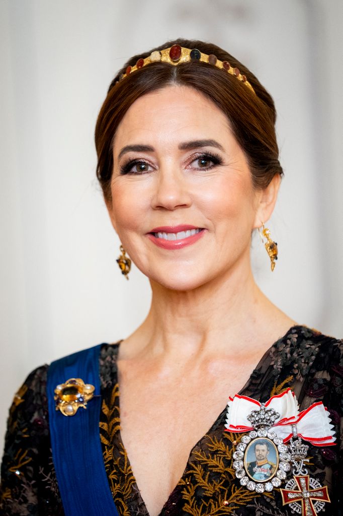 Queen Mary of Denmark smiles during a gala dinner at the Presidential Palace in Helsinki, Finland