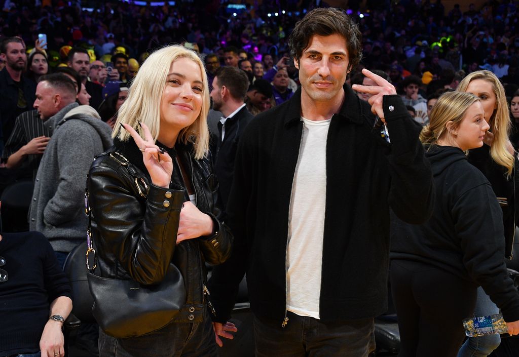 Ashley Benson and Brandon Davis attend a basketball game between the Los Angeles Lakers and the Miami Heat at Crypto.com Arena on January 04, 2023 in Los Angeles, California