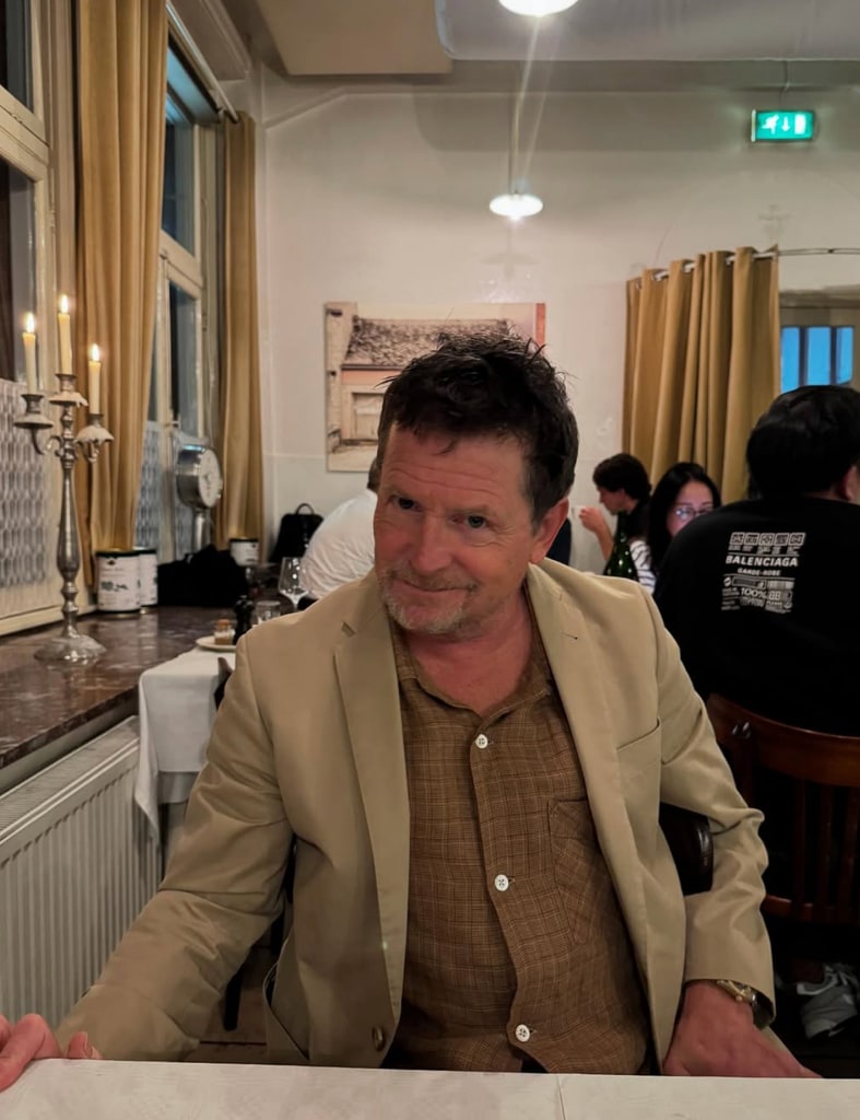 Photo shared by Tracy Pollan of Michael J. Fox at a restaurant in honor of his 65th birthday, June 2025