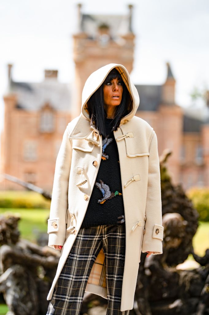 Claudia Winkleman wearing a cream duffle coat with a hood on the traitors 2026
