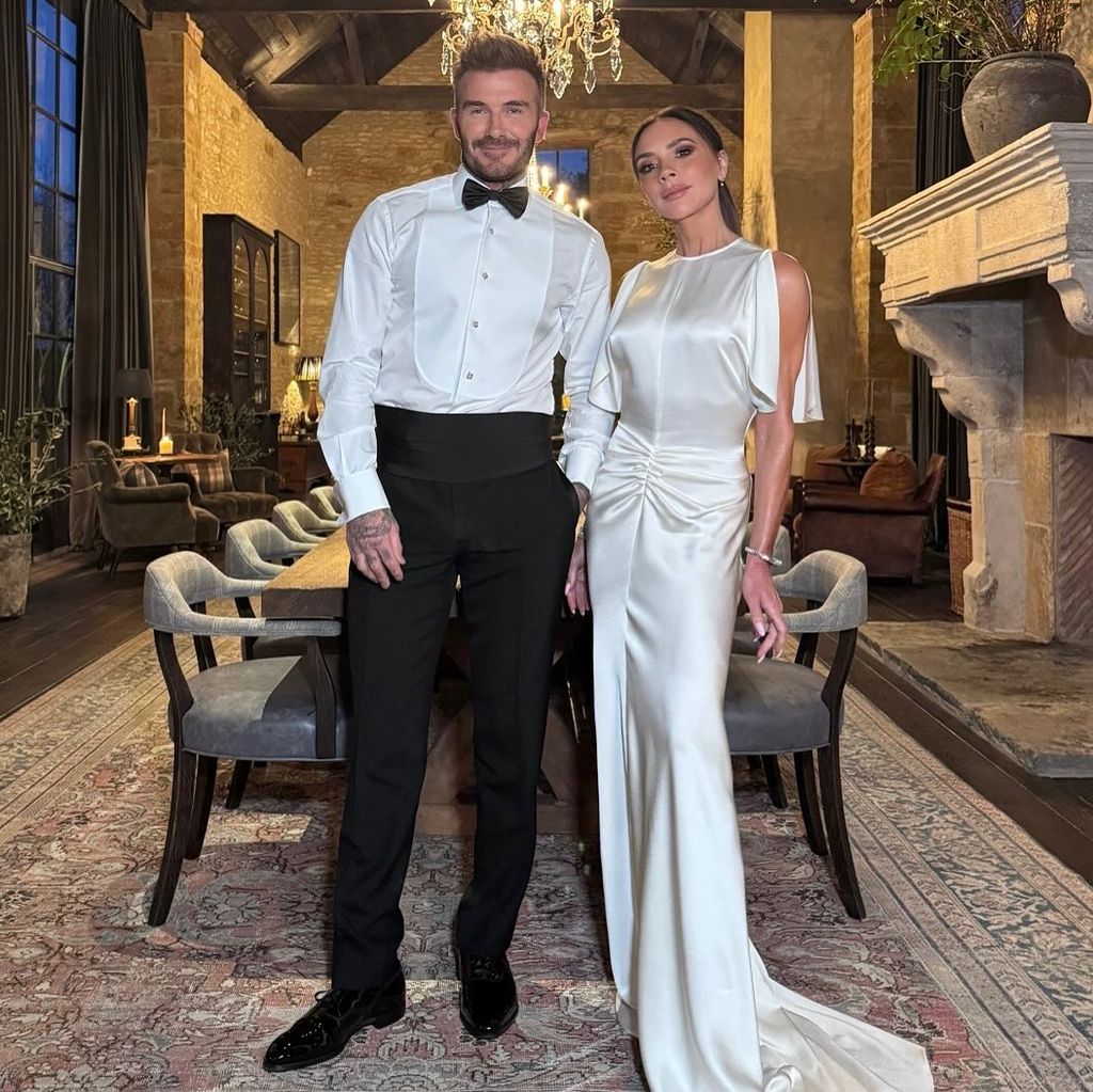 David and Victoria Beckham pose for photo in their huge dining hall at their Cotswolds farmhouse